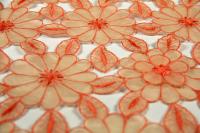 ткань Оранжевая органза с фактурными цветами (нашитыми цветами)