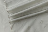 ткань подклад из вискозы бело-серого цвета с гербами и надписями